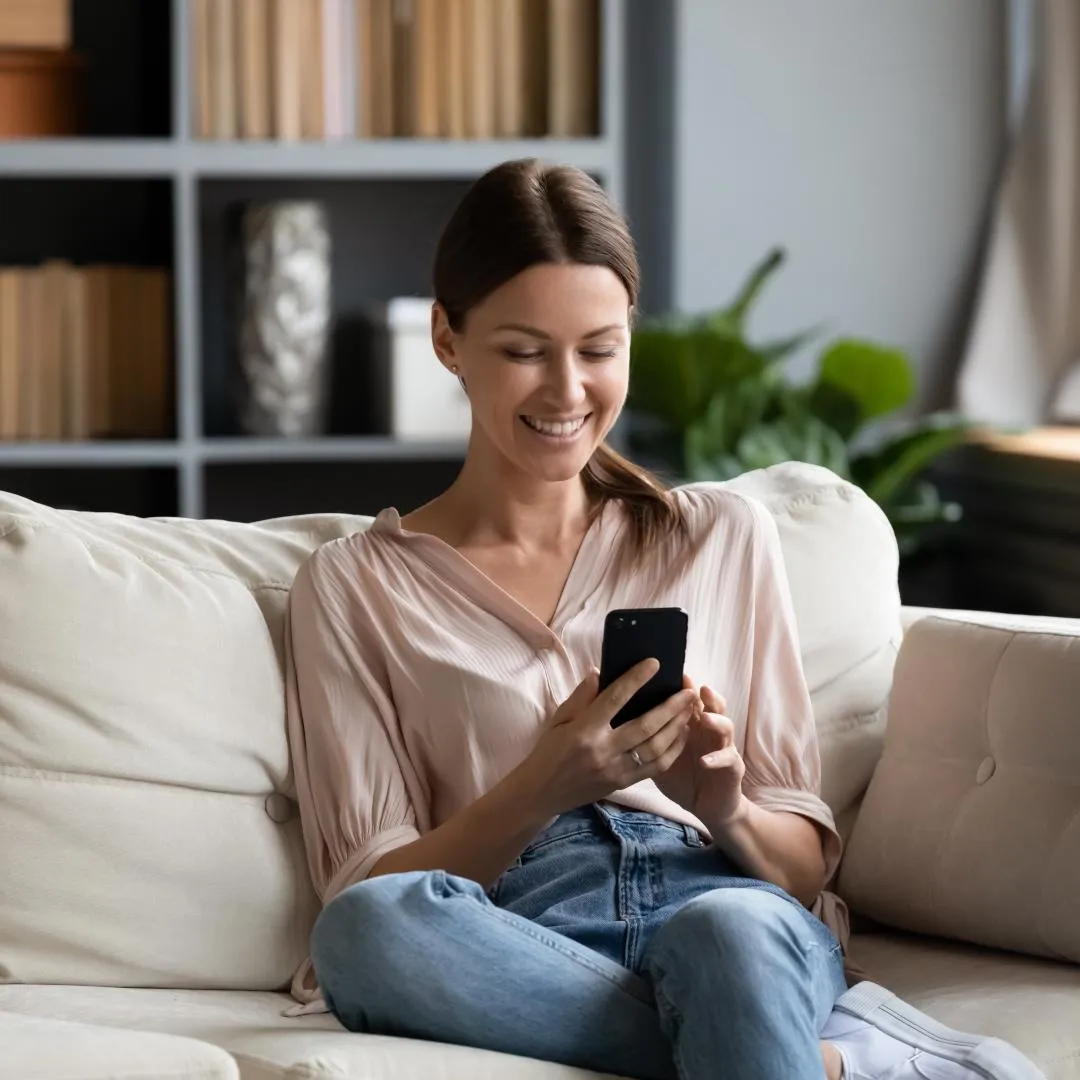 Woman booking a Little City Treat treatment at home